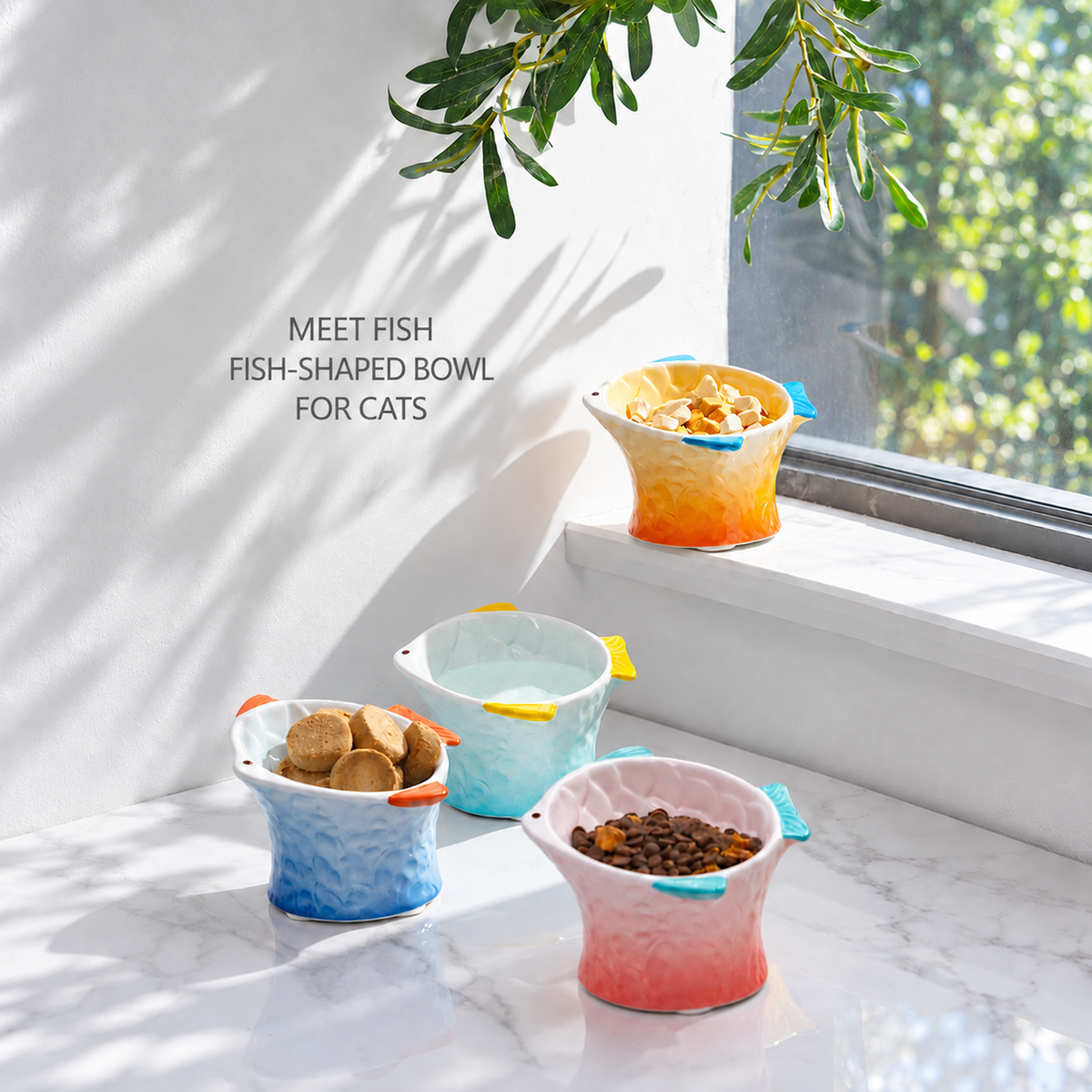 Hocc gradient fish-shaped ceramic cat bowl in a bright window scene with four color options [Gallery: Lifestyle]