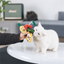 White cat interacting with a hand-held set of food-shaped matatabi toys