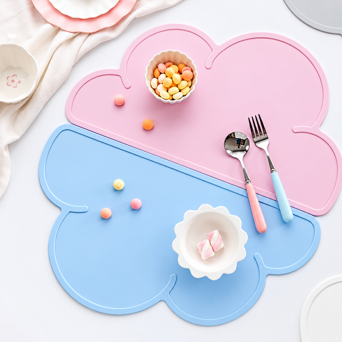 Revised lifestyle image of pink and blue silicone pet bowl mats with snacks