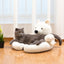 Gray cat lounging on a white polar bear pet sofa