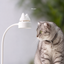 Cat-shaped rechargeable desk lamp in a cozy reading scene
