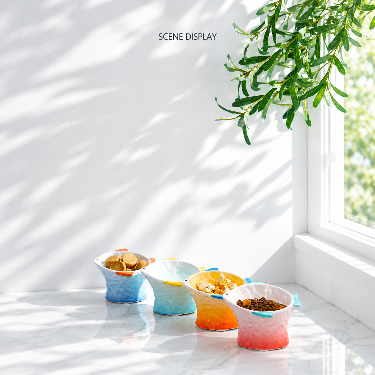 Hocc gradient fish-shaped ceramic cat bowls displayed together in a bright home scene [Gallery: Lifestyle]