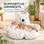 Supportive rounded armrests on a white polar bear pet sofa