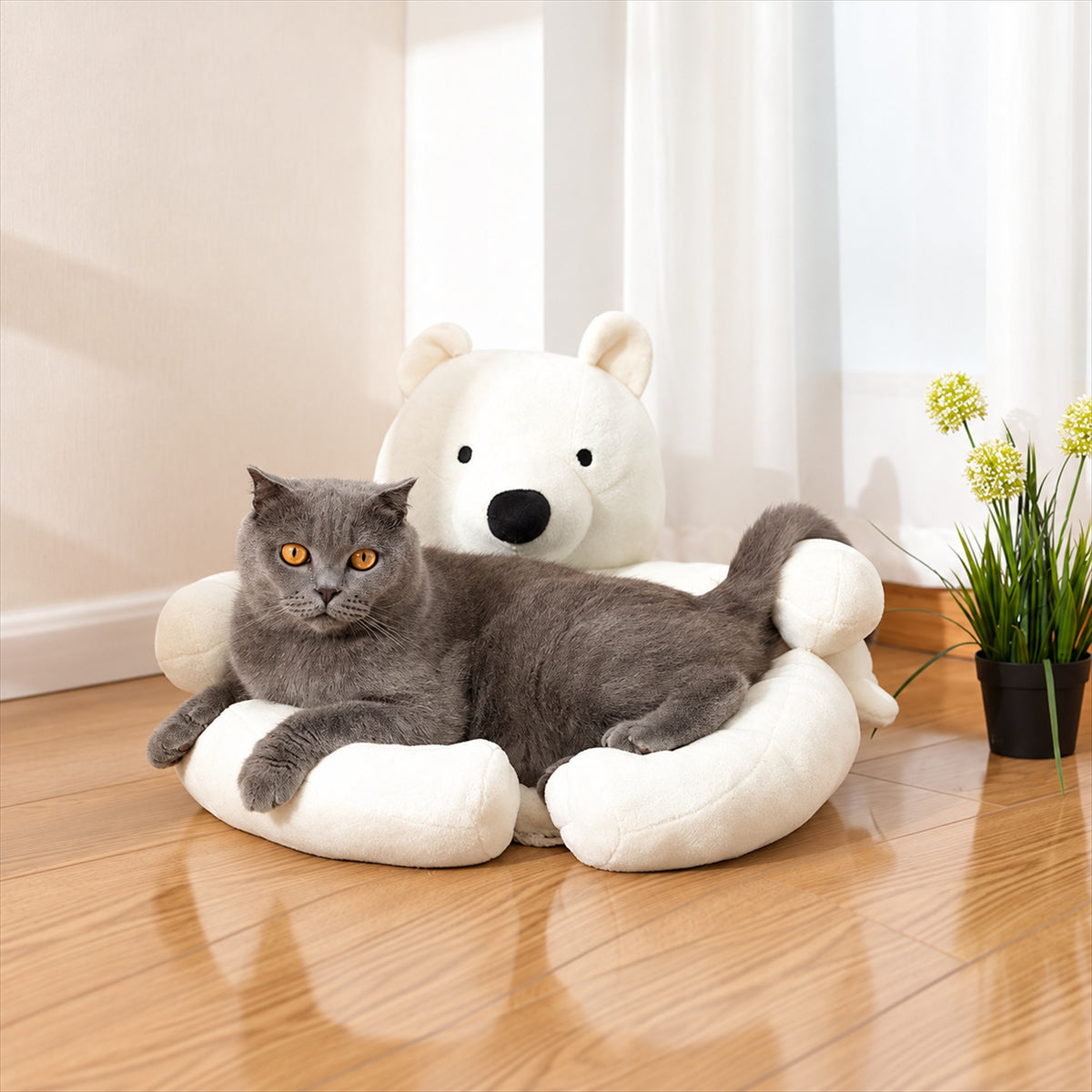 Gray cat stretching on a white polar bear pet sofa