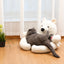 Gray cat reclining on a white polar bear pet sofa with bear companion