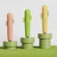 Cactus LED pet nail grinder shown in grass green, tangerine orange, and goose yellow