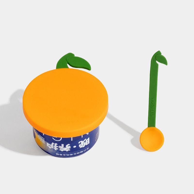 VETRESKA Tangerine orange can lid on a cat food can with spoon