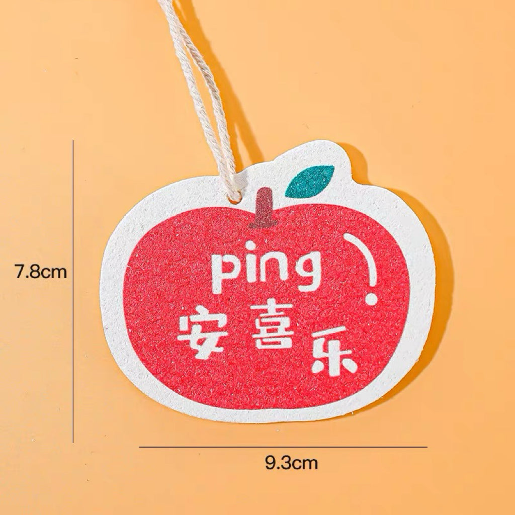Apple cellulose pulp dish scrubber on a white background