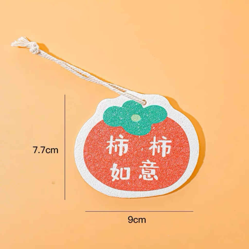Persimmon cellulose pulp dish scrubber on a white background