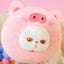 White cat wearing a pink pig plush pet neck warmer