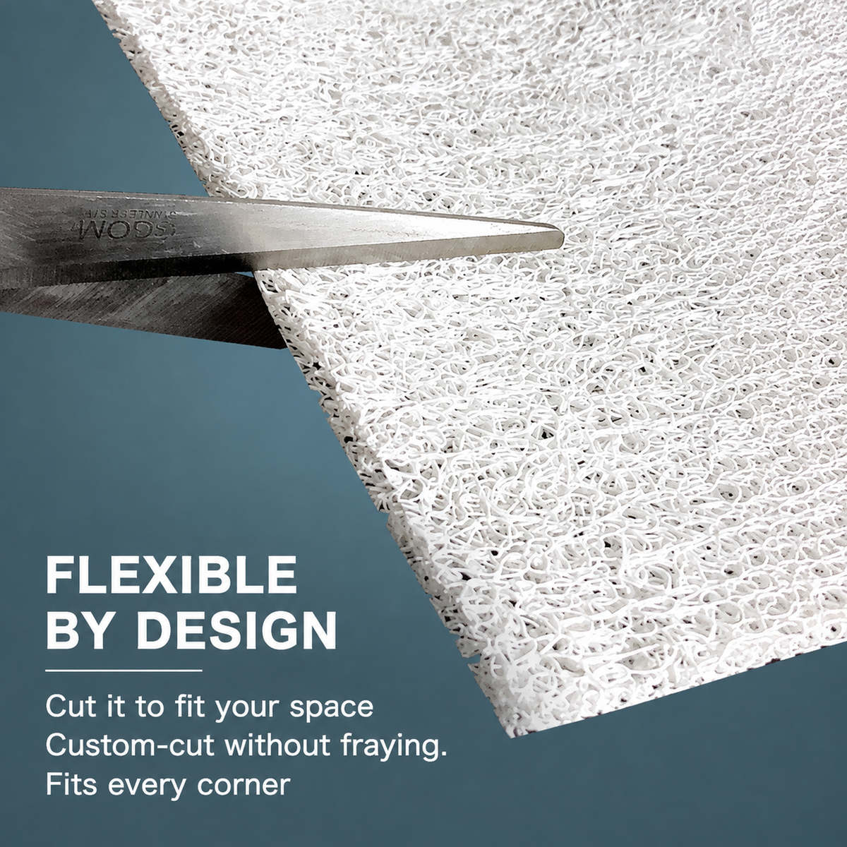 Scissors cutting an 80 x 50 cm washable cat litter mat to fit a space [Gallery: Shared / Features]