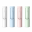 White blue pink and green reusable pet hair remover rollers on a white background