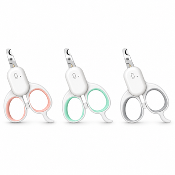 Pink, green and grey LED cat nail scissors on a white background