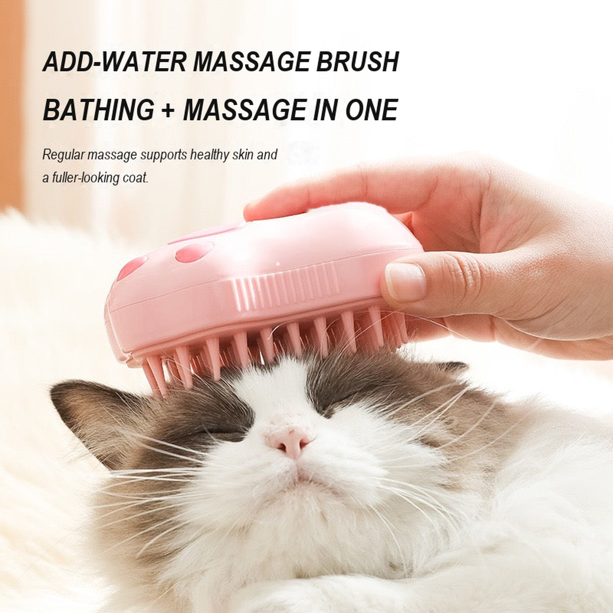 Pink cat-paw brush used on a cat for bathing and massage