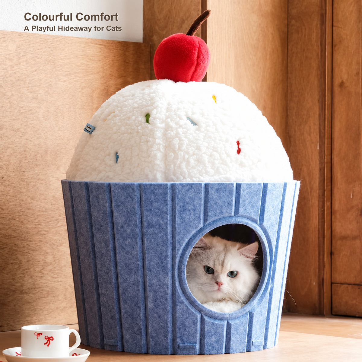 Blue cupcake-shaped cat house with a cat inside and colourful comfort details [English revision]