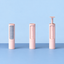 Three-color portable lint remover rollers displayed on a blue surface