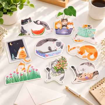 Cat-themed die-cut postcards arranged for a handwritten note