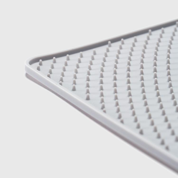 Close-up of the raised ripple surface on a Pidan silicone cat litter mat