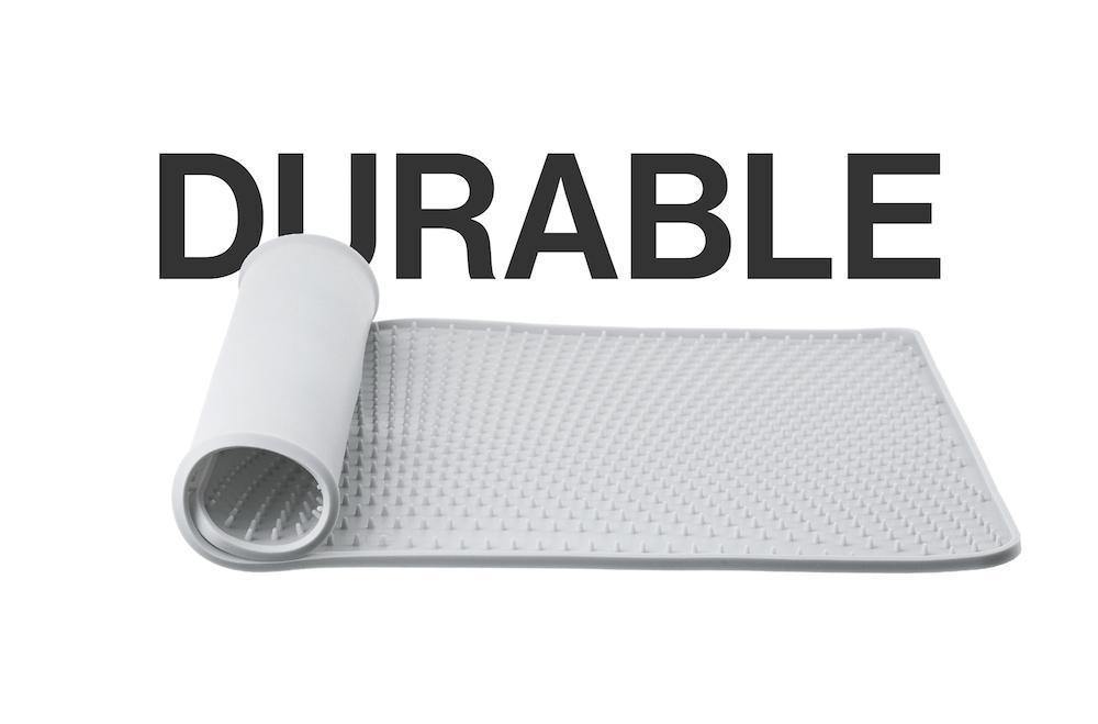 Rolled Pidan silicone cat litter mat showing flexible storage