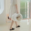 Wulee Space Bag pet carrier lifestyle image with a person carrying the white carrier [Gallery: Lifestyle]
