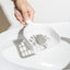 MAYITWILL cat litter scoop separating a clump for cleaning