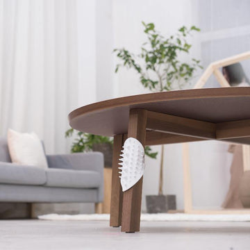 Pidan Self-Massaging Cat Brush mounted under a table for self-grooming [Gallery: Shared]
