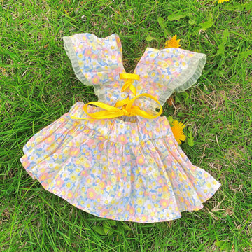 Monin & B1GGERFISH floral pet dress laid flat on grass [Gallery: Lifestyle]